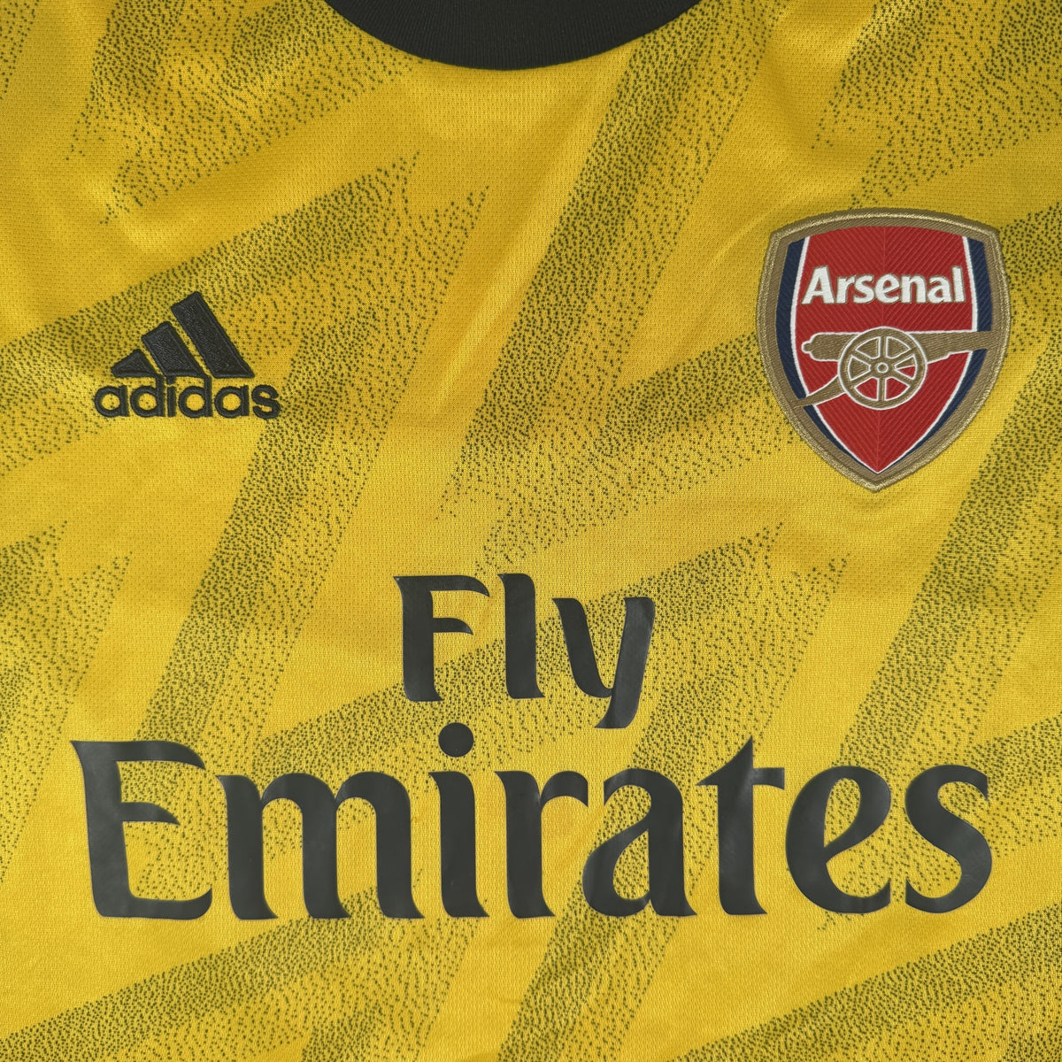 Close-up of Arsenal 2019/2020 away football shirt, size Medium