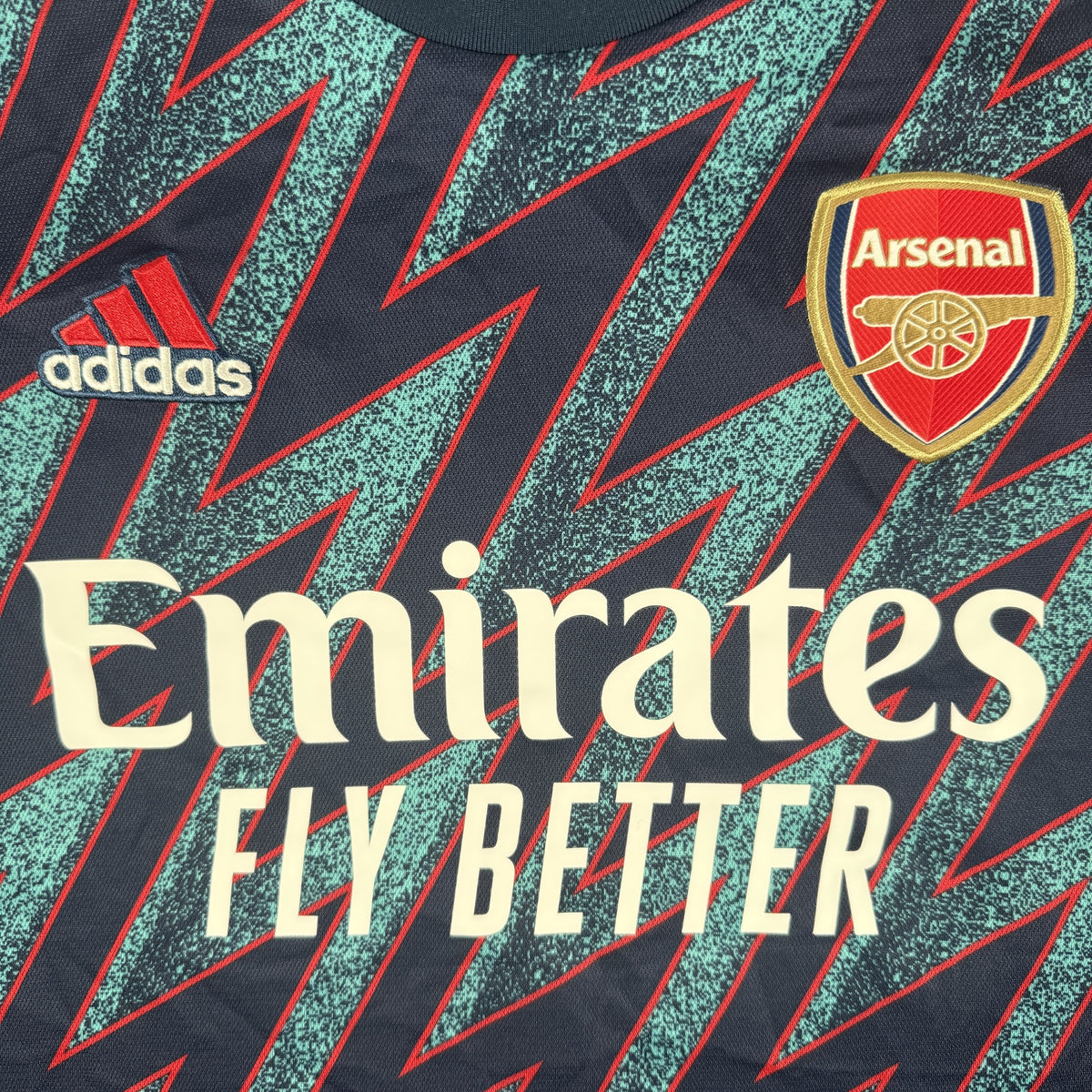 Close-up of Arsenal 2021/2022 third football shirt, size Large