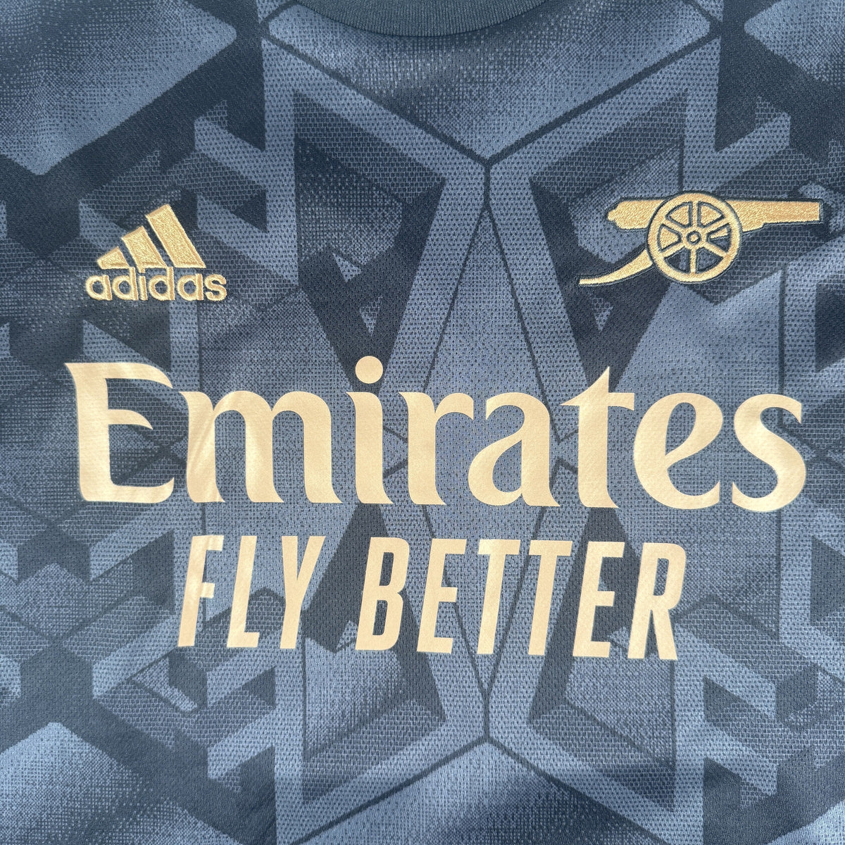 Size label inside Arsenal 2022/2023 away football shirt, size Large