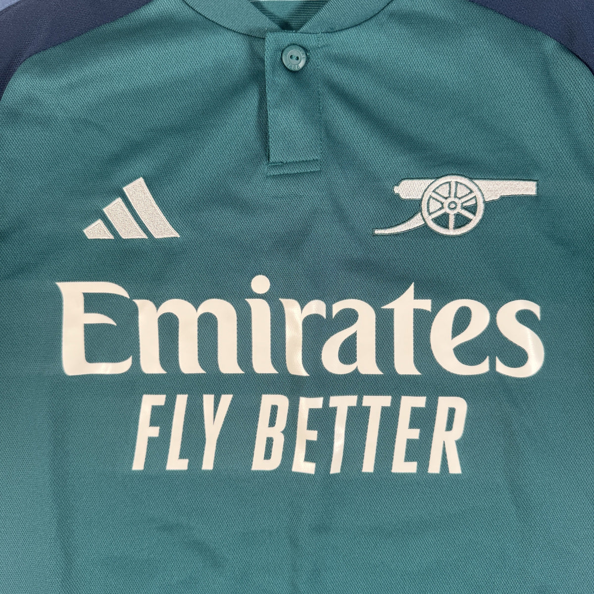 Close-up of Arsenal 2023/2024 third football shirt, size Small