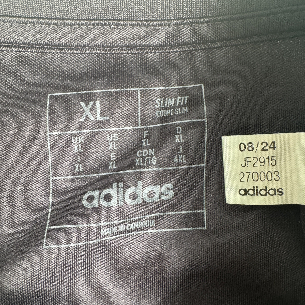Size label inside Arsenal 2024/2025 training football shirt, size XL