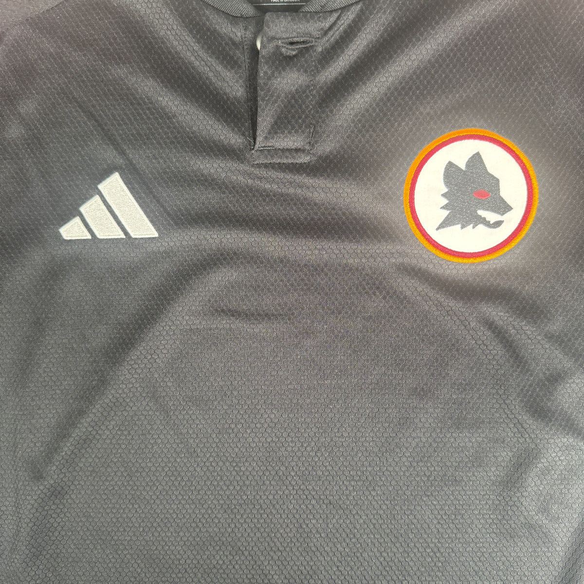 Close-up of AS Roma 2023/2024 third football shirt, size Medium