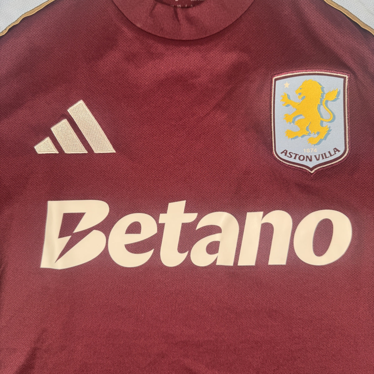 Close-up of Aston Villa 2025/2026 home football shirt, size Large