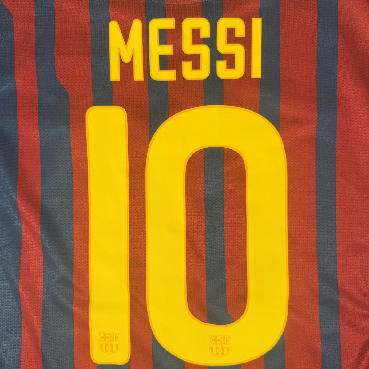 Close-up of Messi 10 on Barcelona 2011/2012 home football shirt, size Large