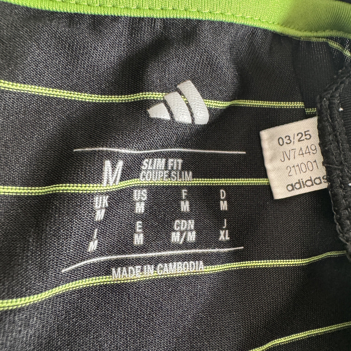 Size label inside Celtic 2025/2026 away football shirt, size Medium