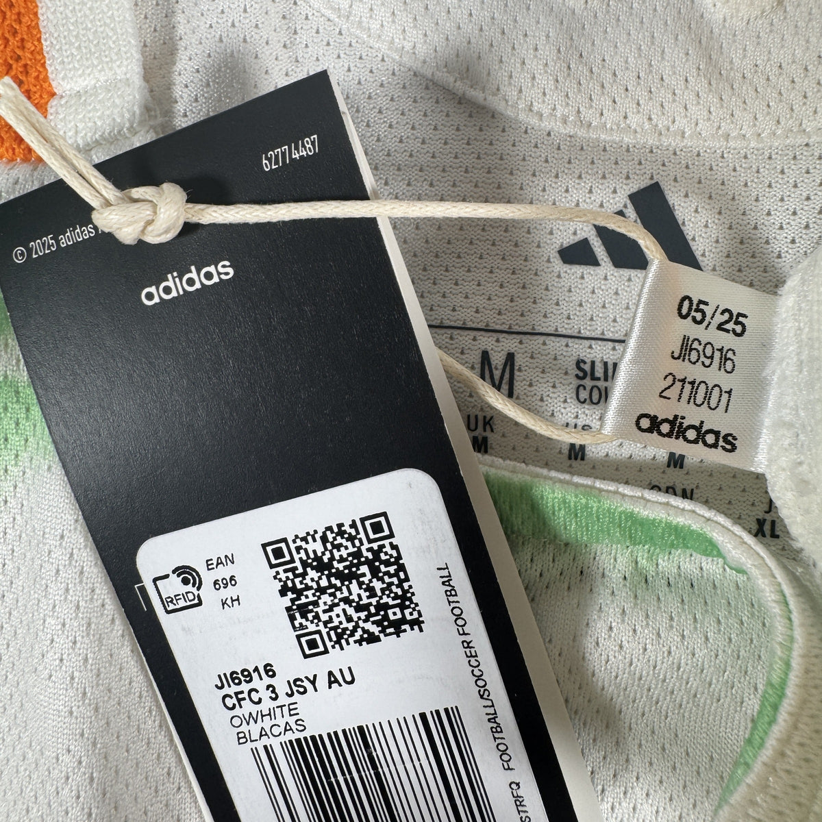 Size label inside Celtic 2025/2026 third football shirt, size Medium