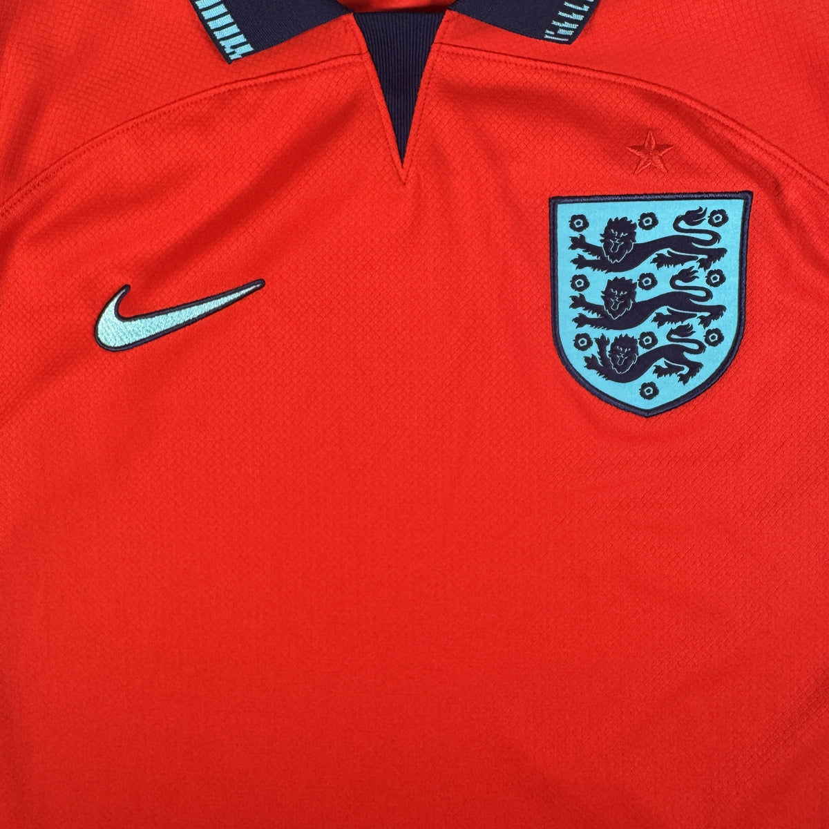 Close-up of England 2022/2023/2024 away football shirt, size Large