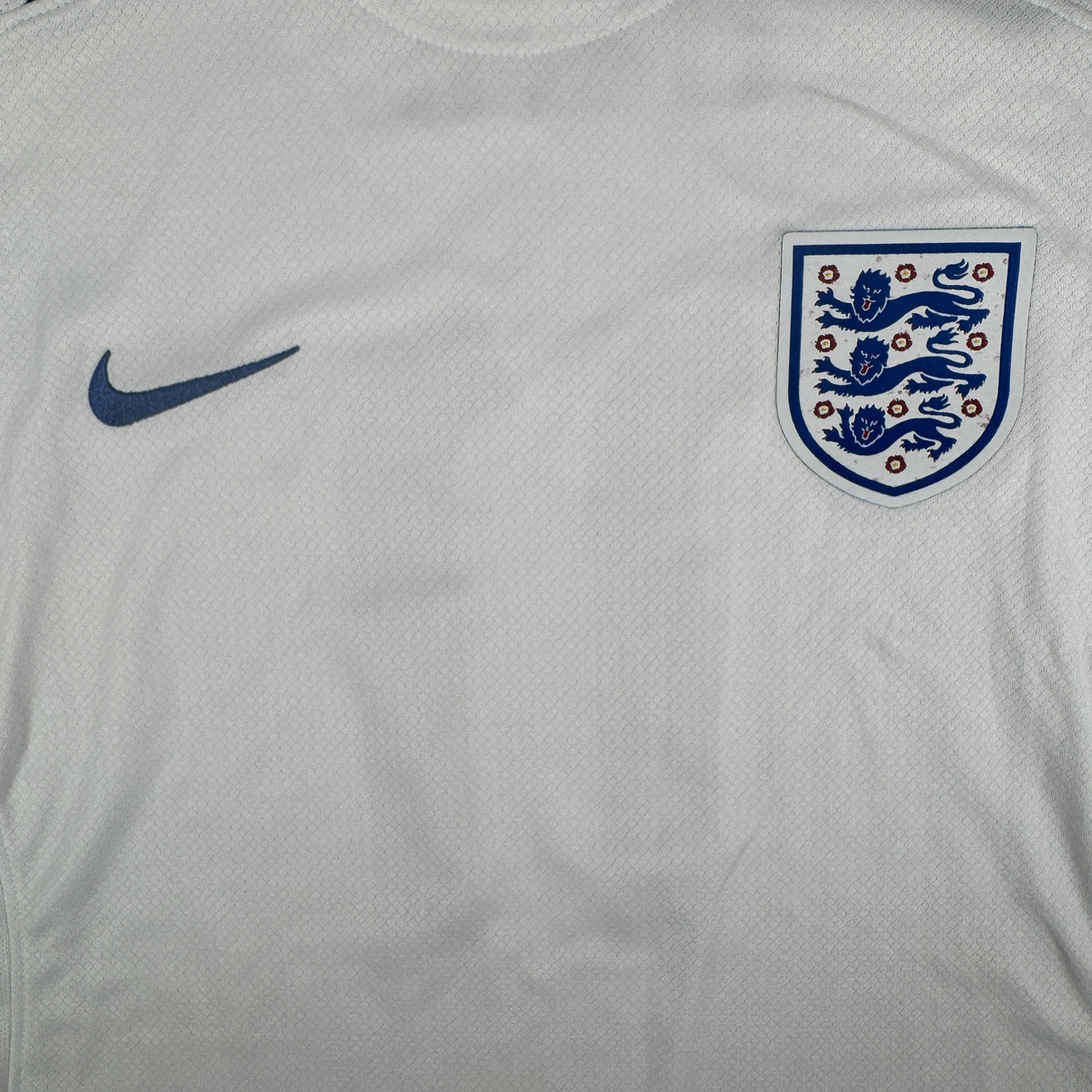 Size label inside England 2023/2024 home football shirt, size Medium