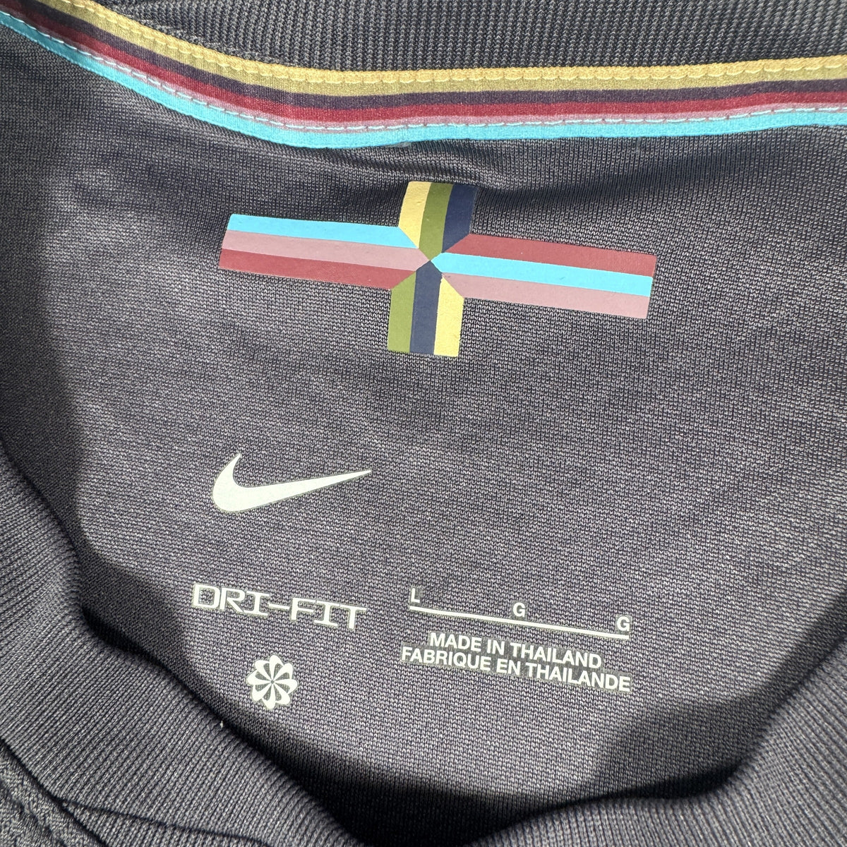 Size label inside England 2024/2025/2026 away football shirt, size Large