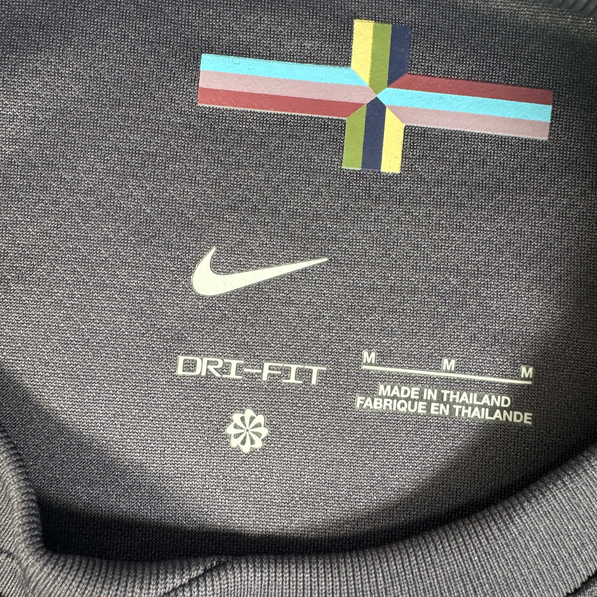 Size label inside England 2024/2025/2026 away football shirt, size Medium