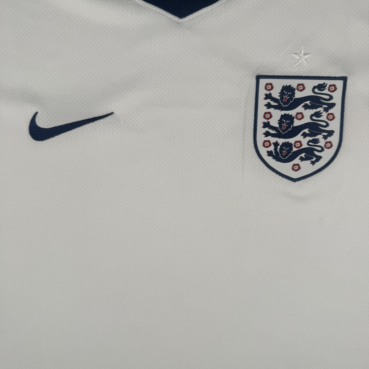 Close-up of England 2024/2025/2026 home football shirt, size Large