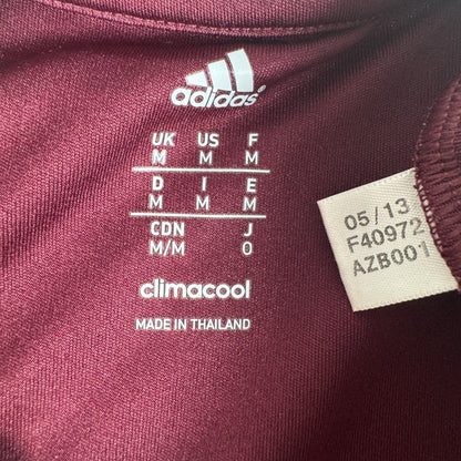 Size label inside Heart of Midlothian 2013/2014 home football shirt, size Medium