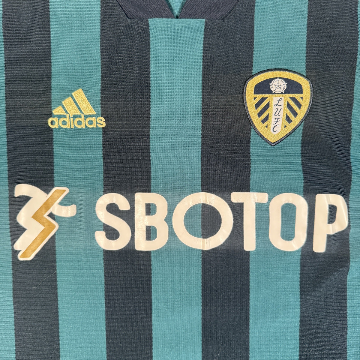 Close-up of Leeds United 2020/2021 away football shirt, size Large
