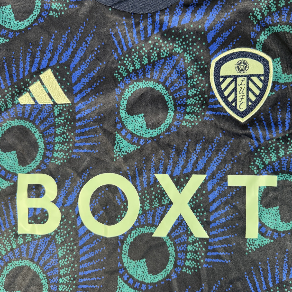 Close-up of Leeds United 2023/2024 away football shirt, size Medium