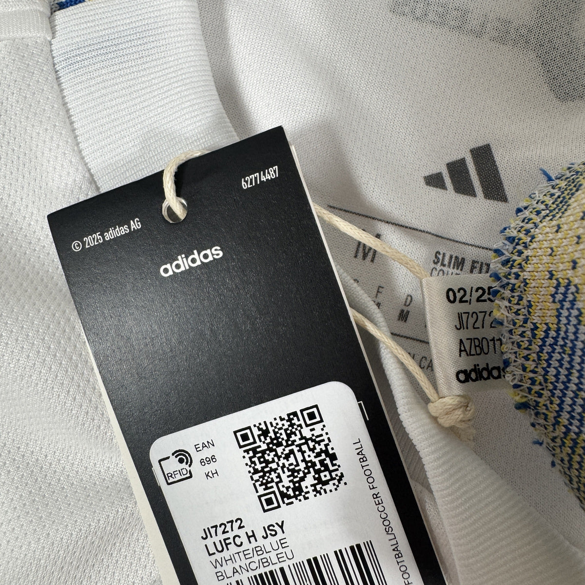 Size label inside Leeds United 2025/2026 home football shirt, size Medium