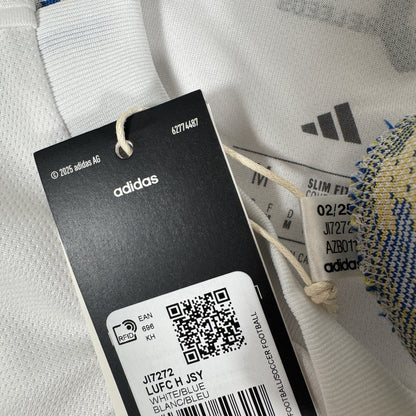 Size label inside Leeds United 2025/2026 home football shirt, size Medium