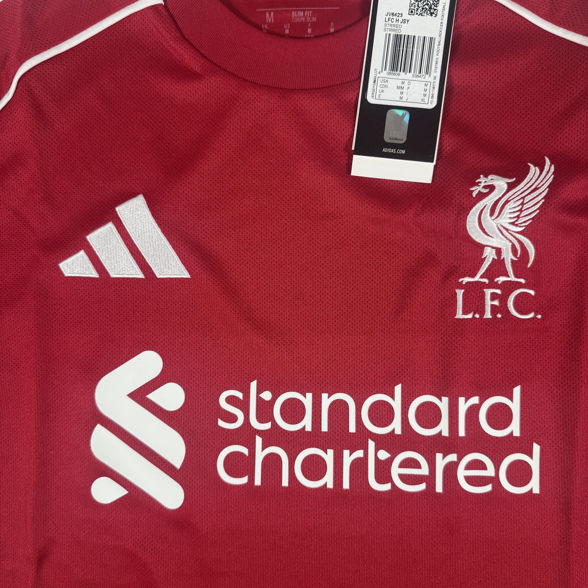 Close-up of Liverpool 2025/2026 home football shirt, size Medium