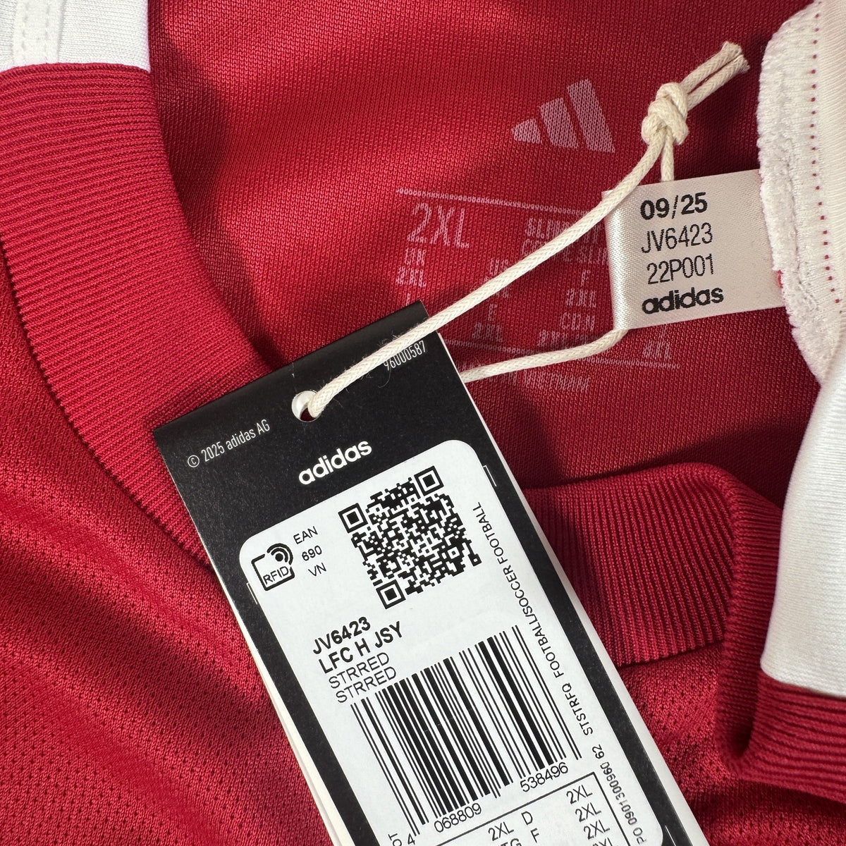 Size label inside Liverpool 2025/2026 home football shirt, size XXL