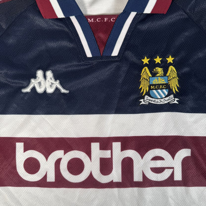 Close-up of Manchester City 1997/1998 away football shirt, size XL