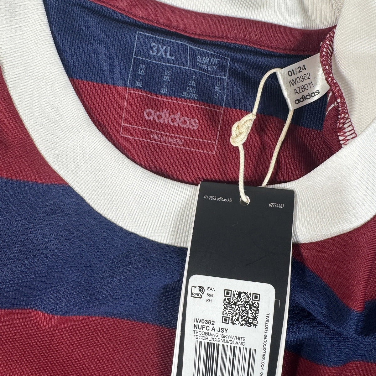 Size label inside Newcastle United 2024/2025 away football shirt, size 3XL