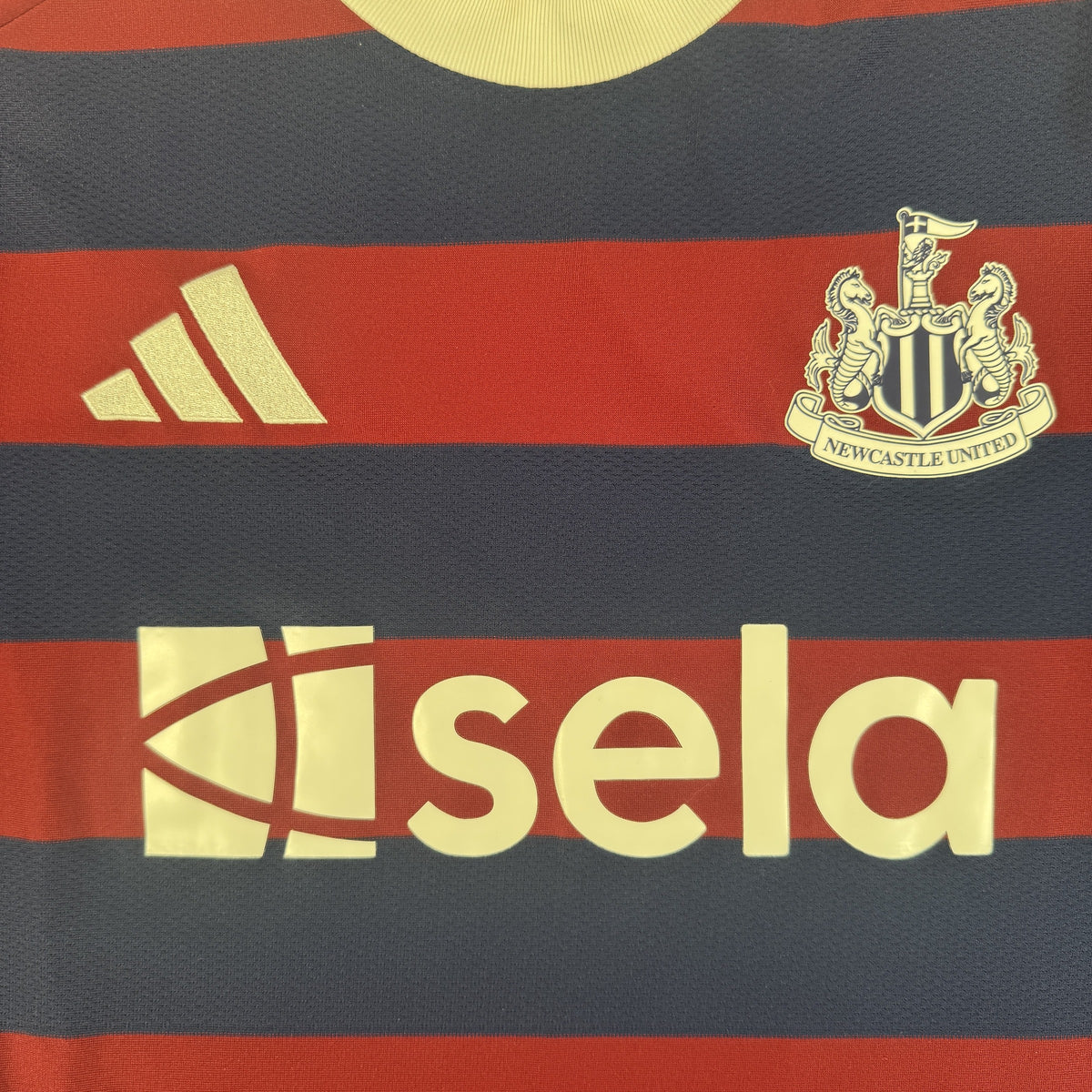 Close-up of Newcastle United 2024/2025 away football shirt, size Large