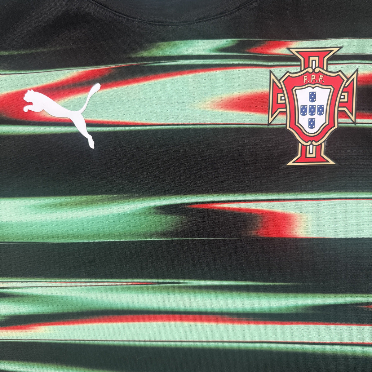 Close-up of Portugal 2025/2026 training football shirt, size Medium