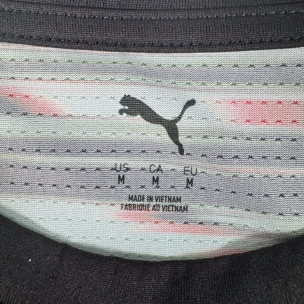 Size label inside Portugal 2025/2026 training football shirt, size Medium