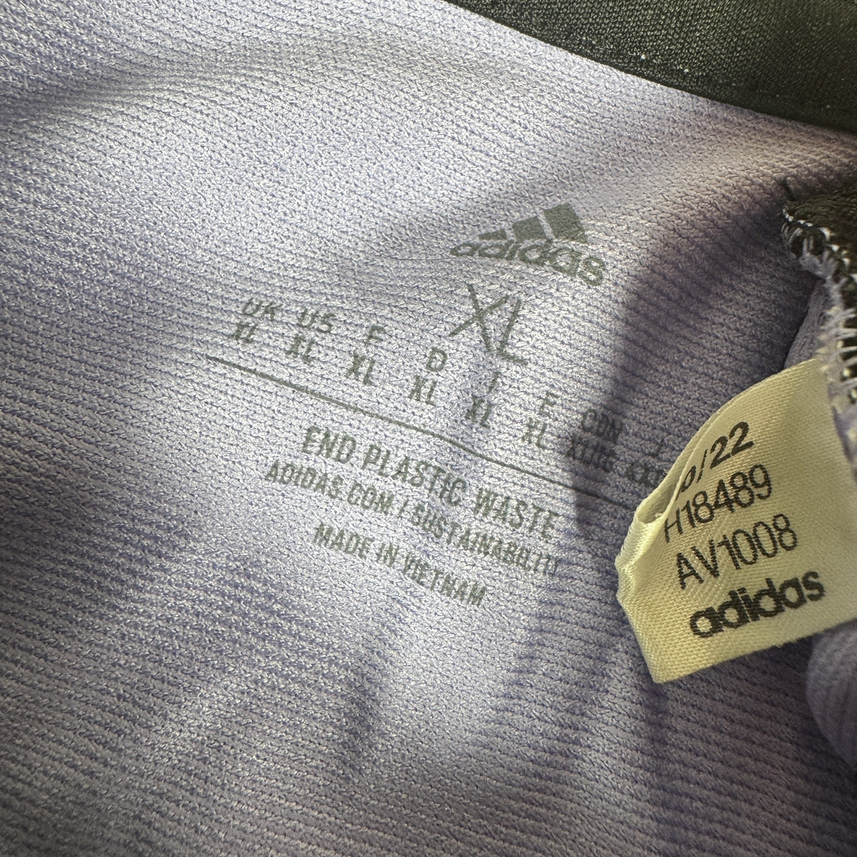 Size label inside Real Madrid 2022/2023 away football shirt, size XL