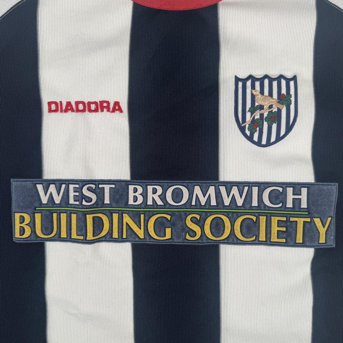 Close-up of West Bromwich Albion 2003/2004 home football shirt, size XL